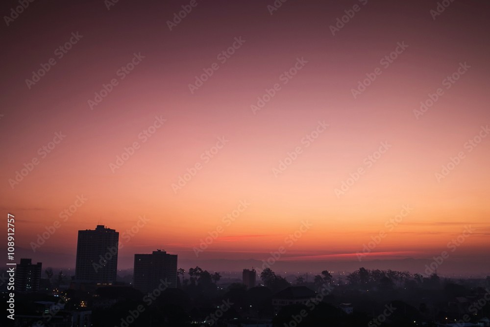 Silhouette, tropical city in dawn with sunrise in Chiang Mai city, Thailand