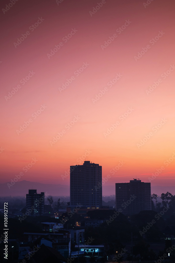 Silhouette, tropical city in dawn with sunrise in Chiang Mai city, Thailand