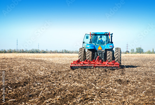 Blue tractor in the field