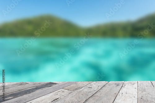 Wood floor top on blue sea background © yotrakbutda