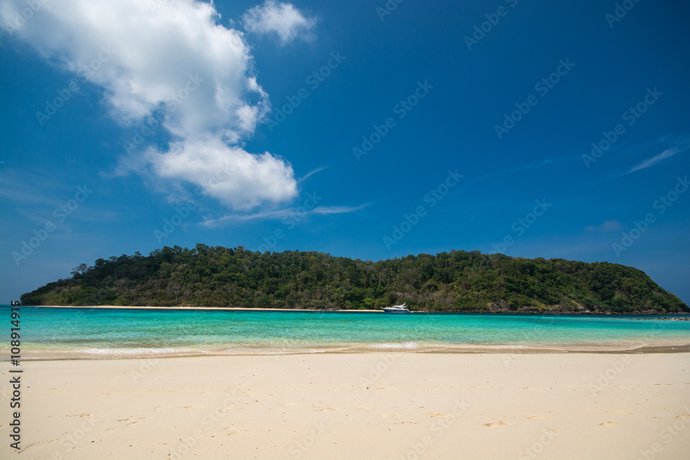 Island and beach in blue sky background