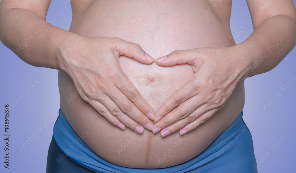 Pregnant woman with hands isolate on white background Pregnant woman with hands isolate on white background