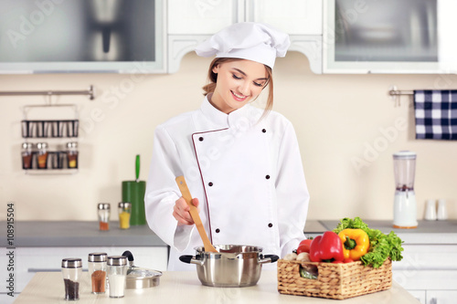 Young woman cooking in the ...