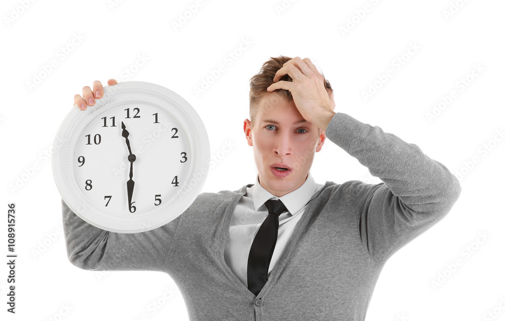 Handsome young man holding clock, isolated on white Handsome young man holding clock, isolated on white