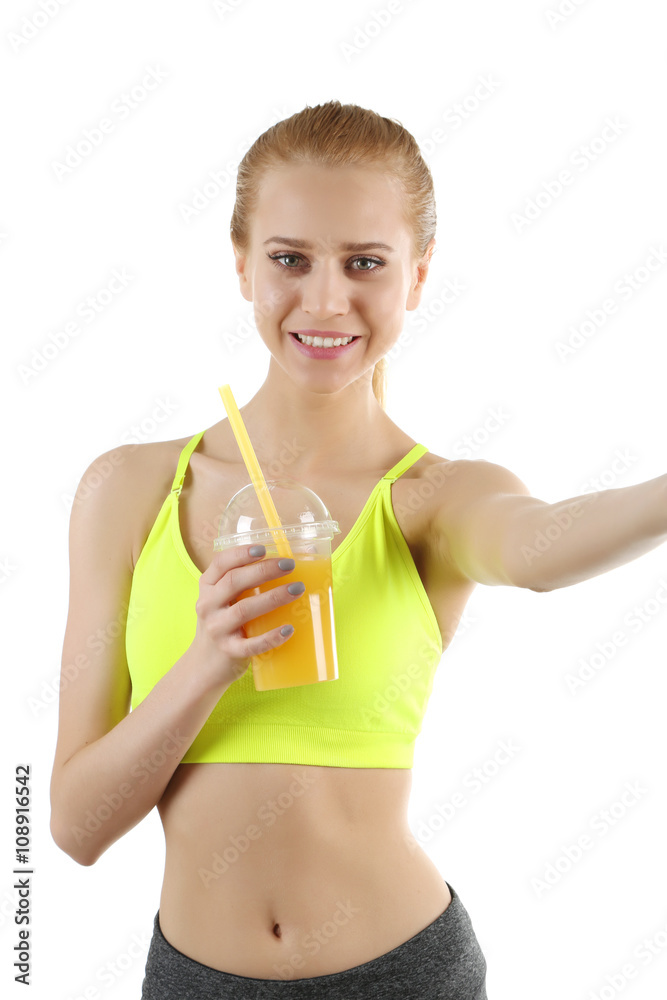 Young woman making selfie photo with plastic cup of orange juice isolated on white Young woman making selfie photo with plastic cup of orange juice isolated on white