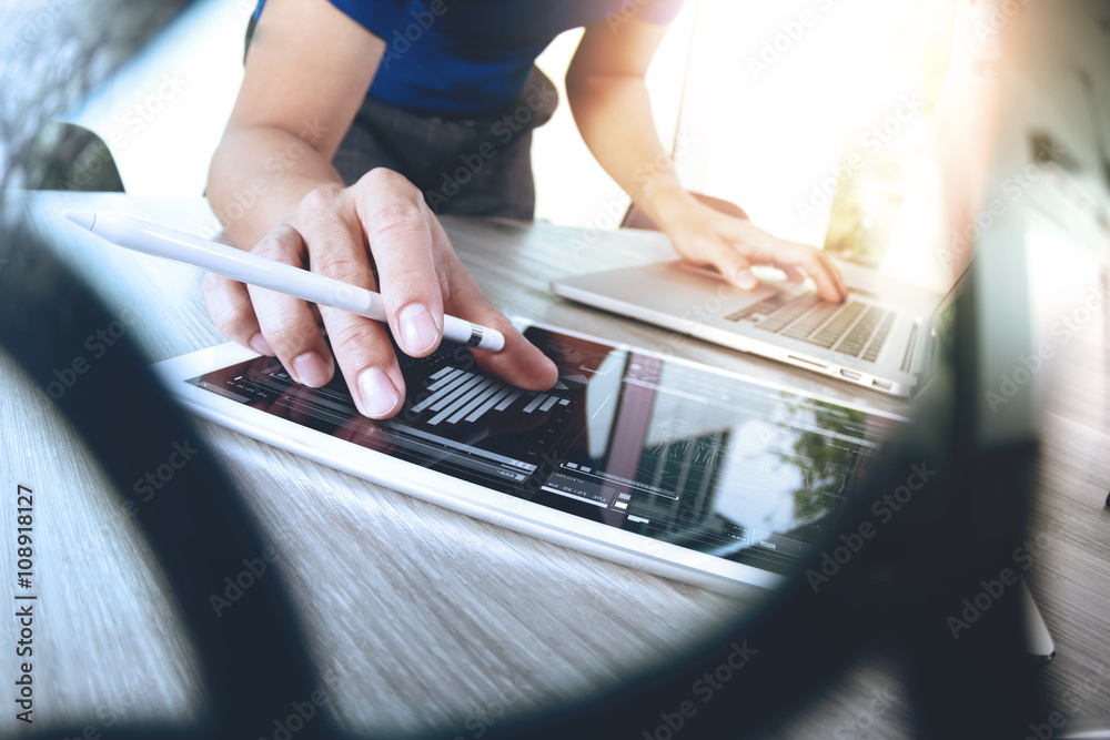 Website designer working digital tablet and computer laptop with Website designer working digital tablet and computer laptop with
