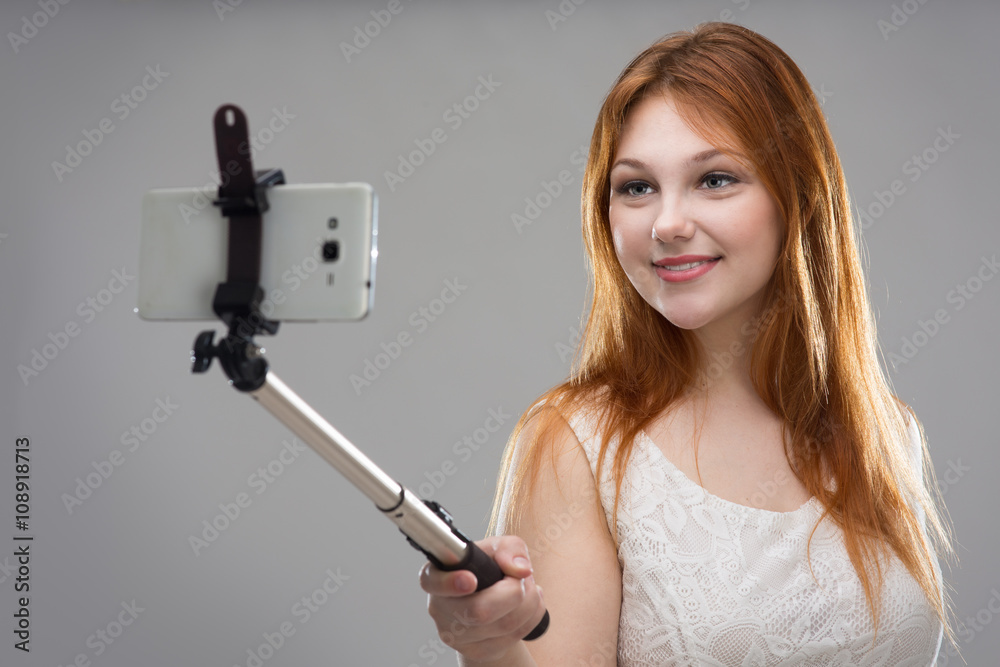 Girl doing selfie with your phone Girl doing selfie with your phone