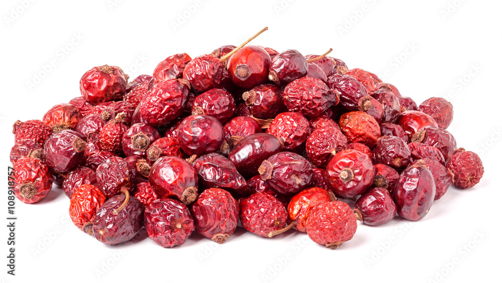 pile of dried rose hips isolated on a white background pile of dried rose hips isolated on a white background