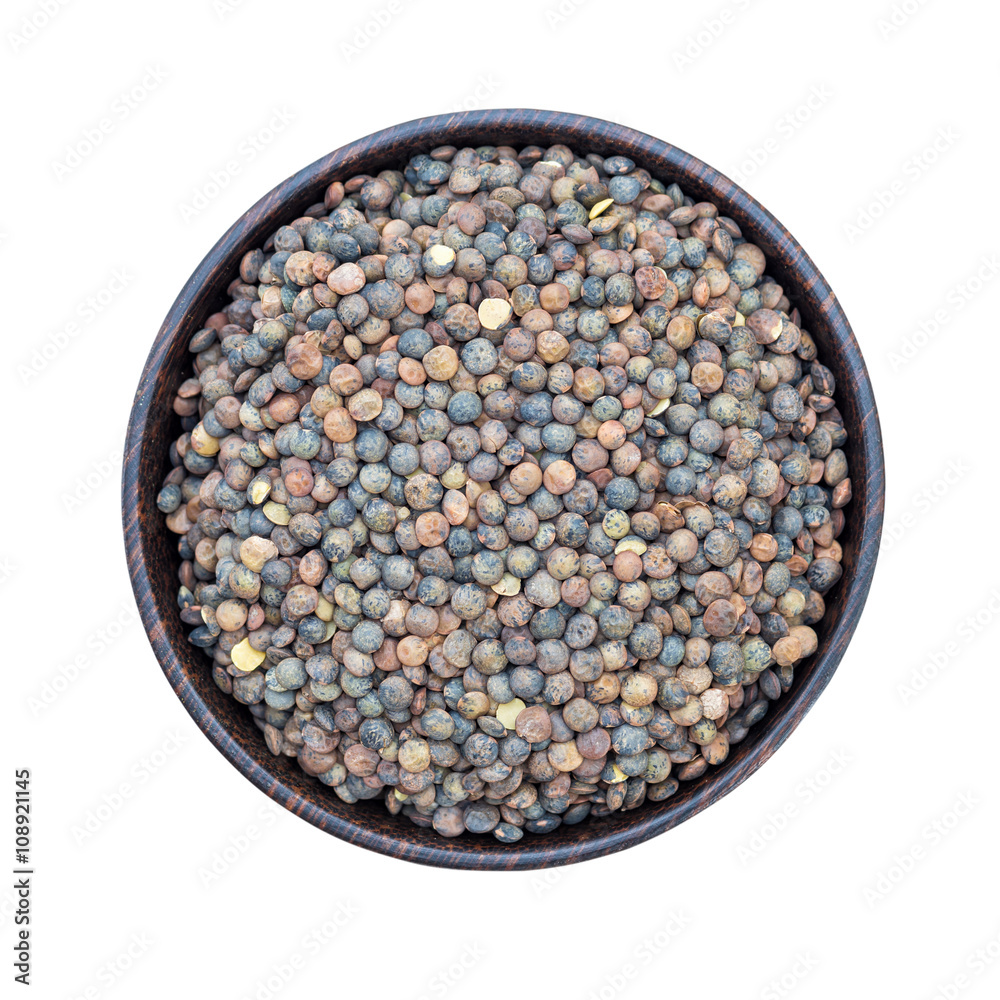 Organic French green lentils in bowl isolated on white background Organic French green lentils in bowl isolated on white background