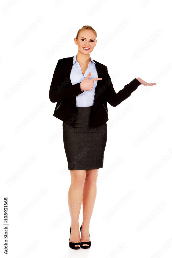 Business woman presenting something on open palm Business woman presenting something on open palm