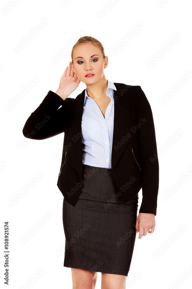 Young business woman overhears a conversation Young business woman overhears a conversation