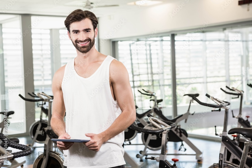 Smiling man holding tablet Smiling man holding tablet