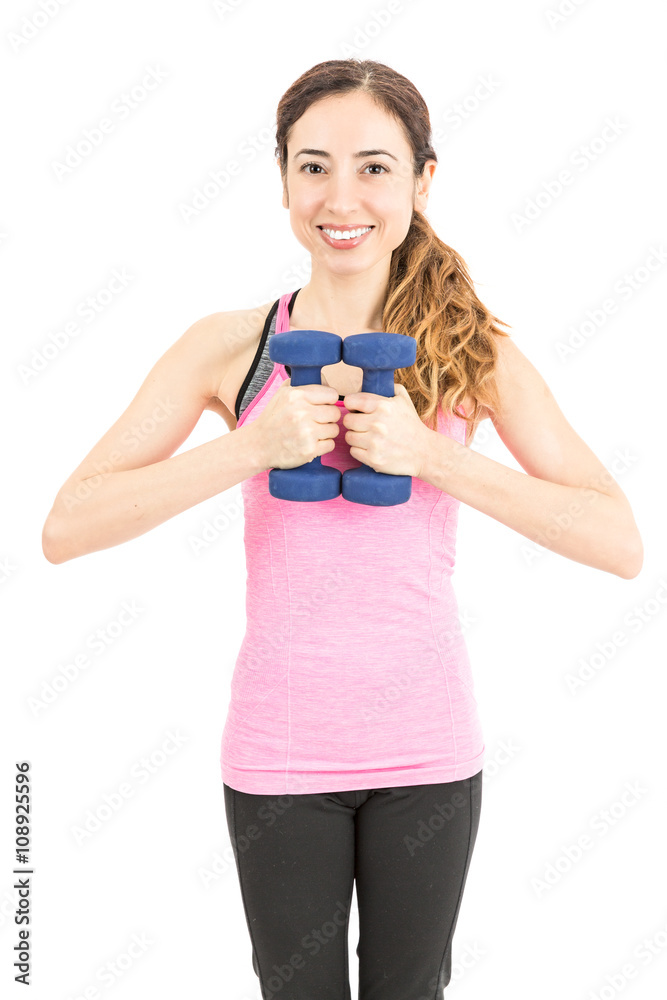 Woman working out with dumbbells Woman working out with dumbbells