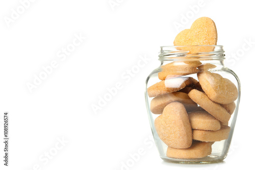 Fotografie transparent open a jar with delicious cookies in the shape of hearts isolated on