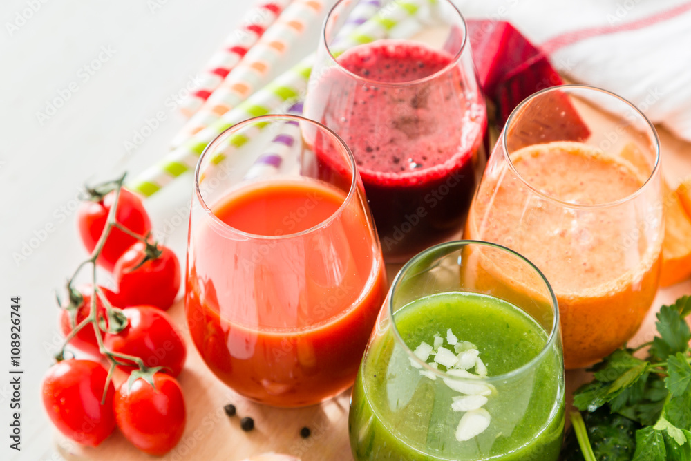 Selection of colorful vegetable juice in glasses Selection of colorful vegetable juice in glasses