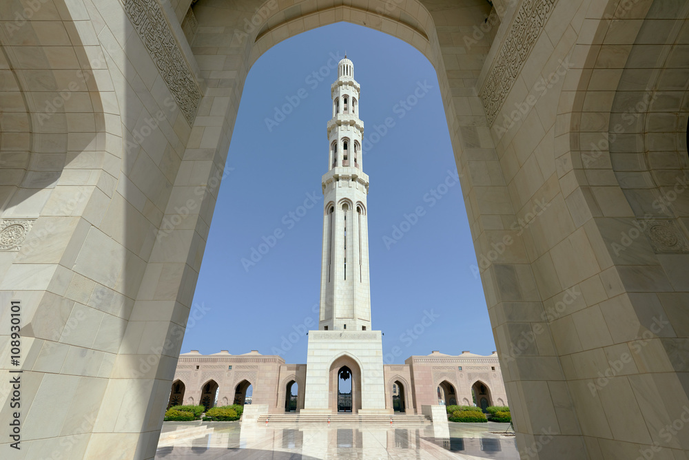 Minaret of a mosque seen through an arch