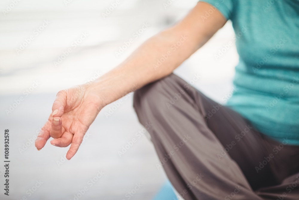 Cropped image of woman doing yoga