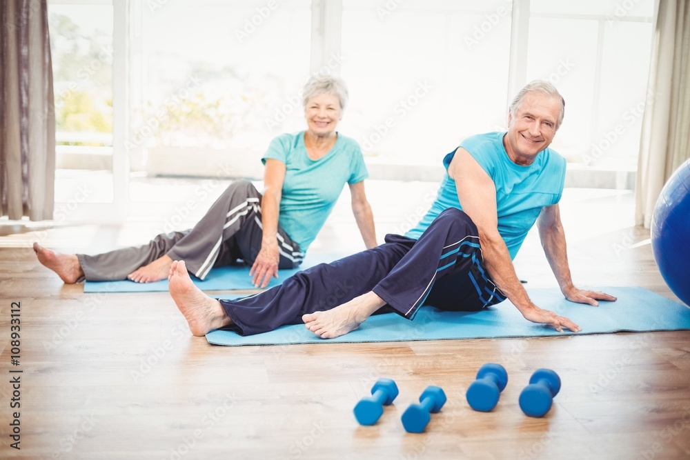 Portrait of smiling senior couple doing yoga Portrait of smiling senior couple doing yoga