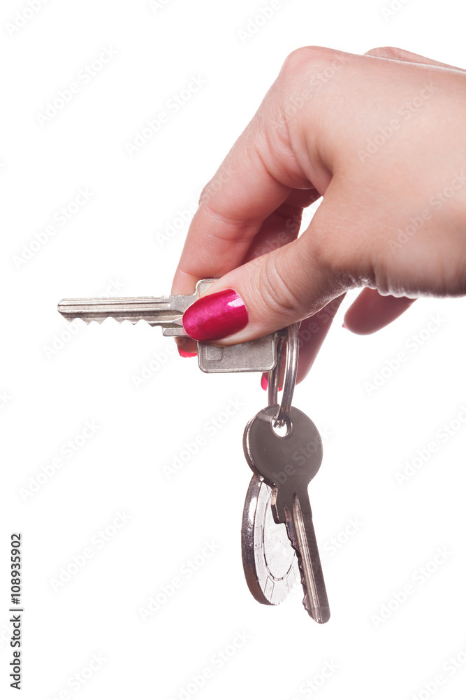 Close up of manicured fingers painted a deep glossy red curling around set of car keys Close up of manicured fingers painted a deep glossy red curling around set of car keys