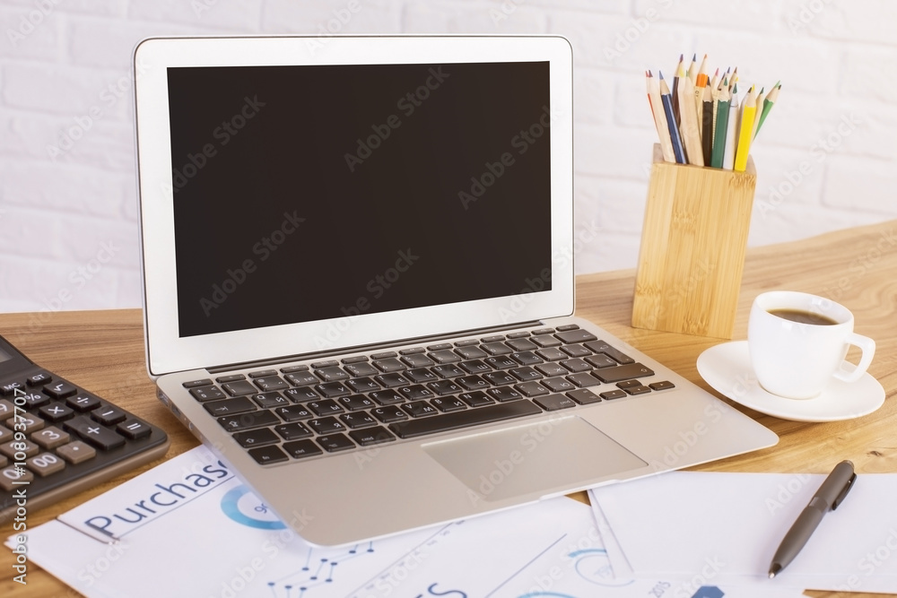 Black laptop and tools Black laptop and tools