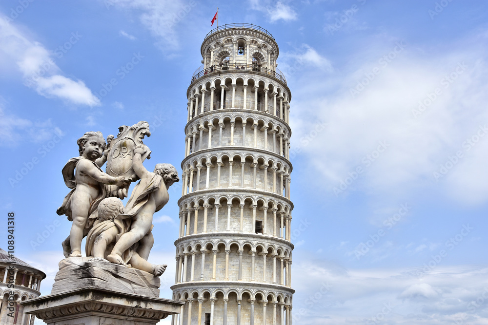 The Leaning Tower of Pisa, a wonderful medieval monument, one of the most famous landamrk in Italy, and the Fontana dei Putti (Fountain with Angels) with city emblem