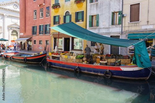 Floating fruit market in Venice, Italy. © moeimyazanyato