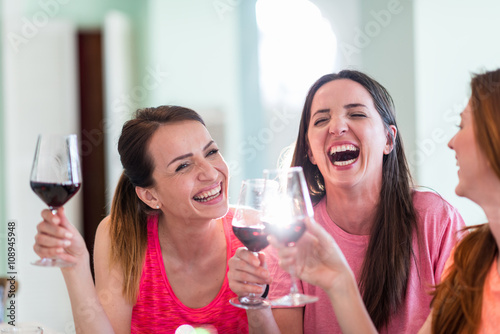 Photography Friends drinking wine in restaurant, having fun
