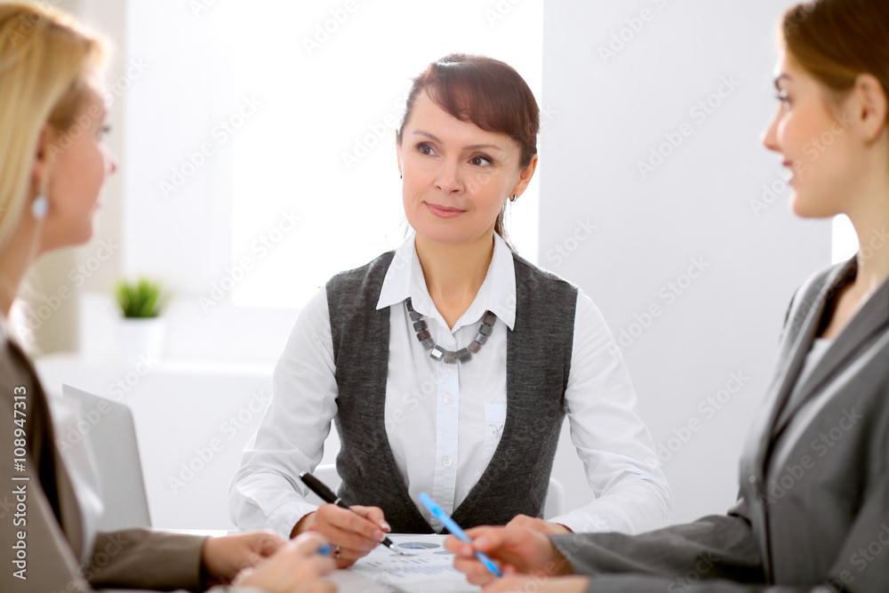 Group of business people working together in office Group of business people working together in office