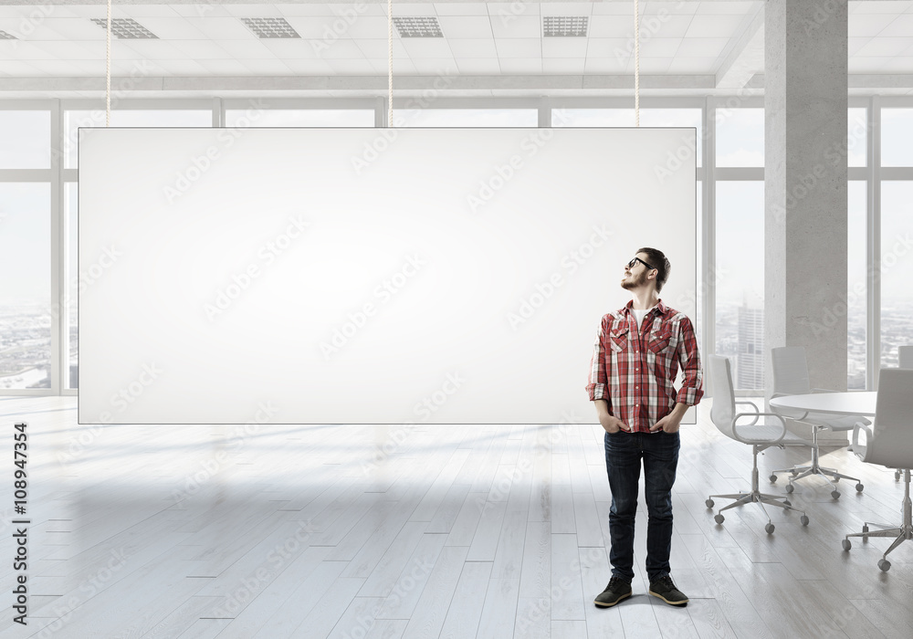 Fototapeta premium Student guy near banner