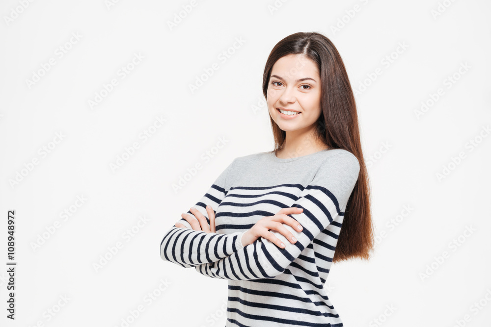Smiling woman with arms folded looking at camera Smiling woman with arms folded looking at camera