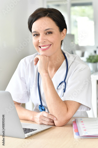 Closeup of beautiful nurse at work