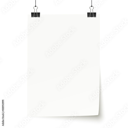 white paper with binder clips