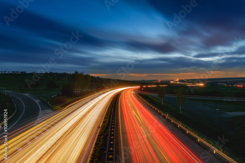 Long-exposure sunset over a highway