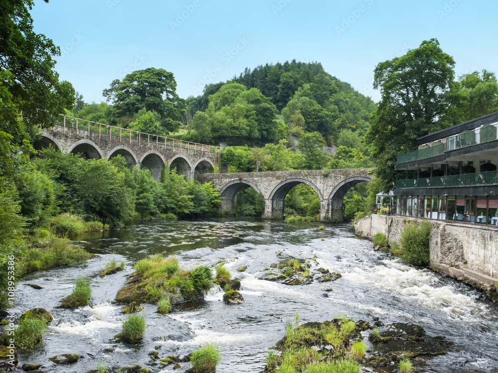 River Dee with road and railway bridges in Llangollen Denbighshire Wales UK