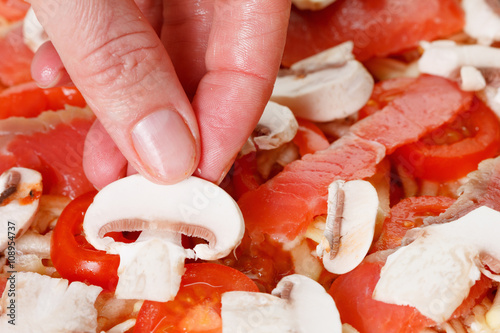 Cooking homemade pizza with...
