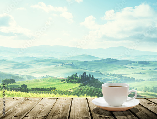 cup coffee and tuscany hills, Italy