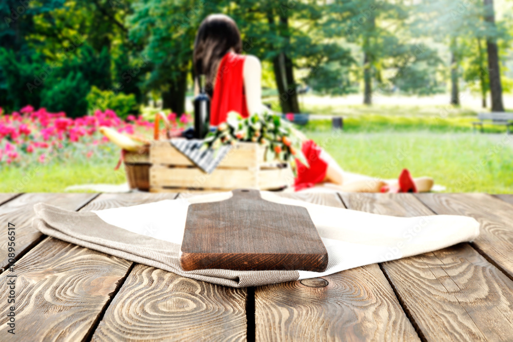 wooden table and woman on grass wooden table and woman on grass