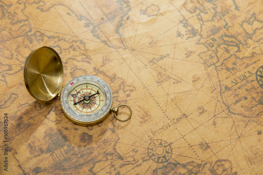 old compass on vintage map