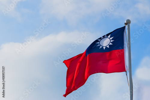 Republic of China (ROC) on Taiwan flag against blue sky and clouds