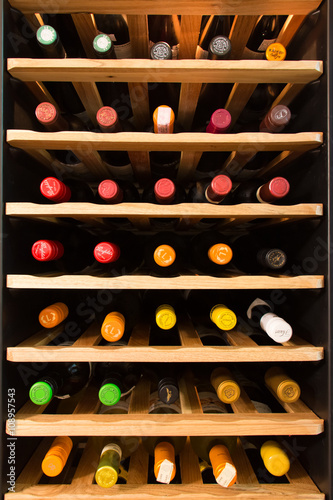 Wine cooler full of wine bottles