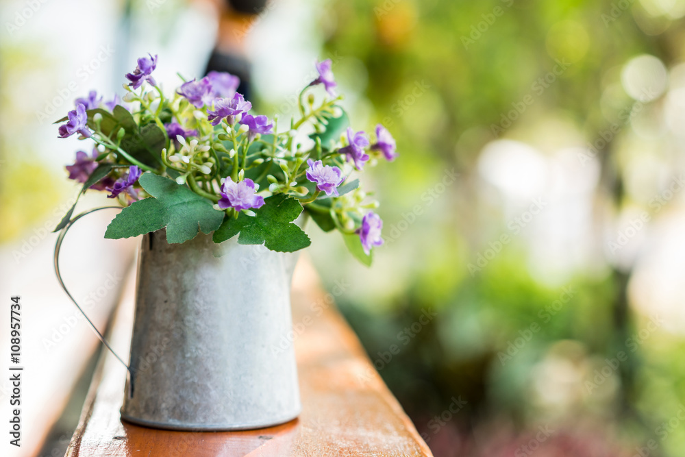 Beautiful flowers in vase on wooden table ,soft focus