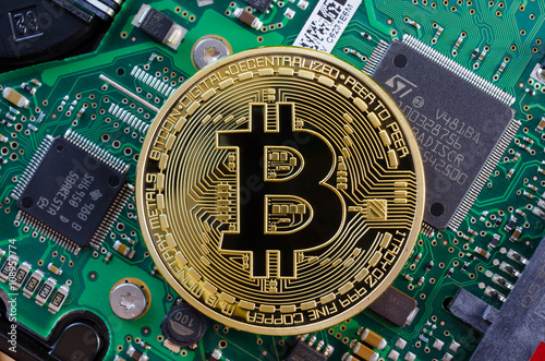 Concept of Bitcoin like a computer chip on motherboard