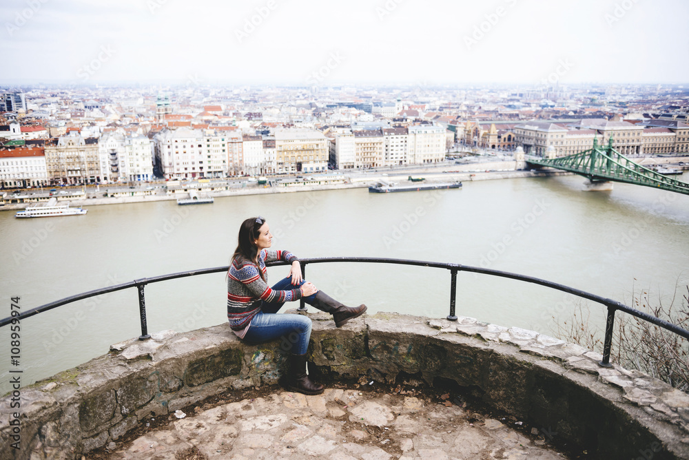 Hungary, Budapest, Woman enjoying the view with Liberty Bridge at Danube river Hungary, Budapest, Woman enjoying the view with Liberty Bridge at Danube river
