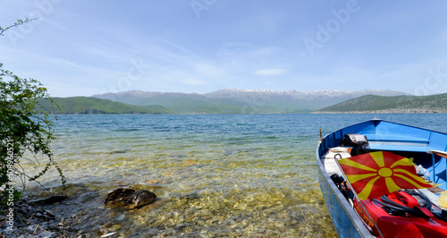Boat with flag in a Lake Prespa in Macedonia