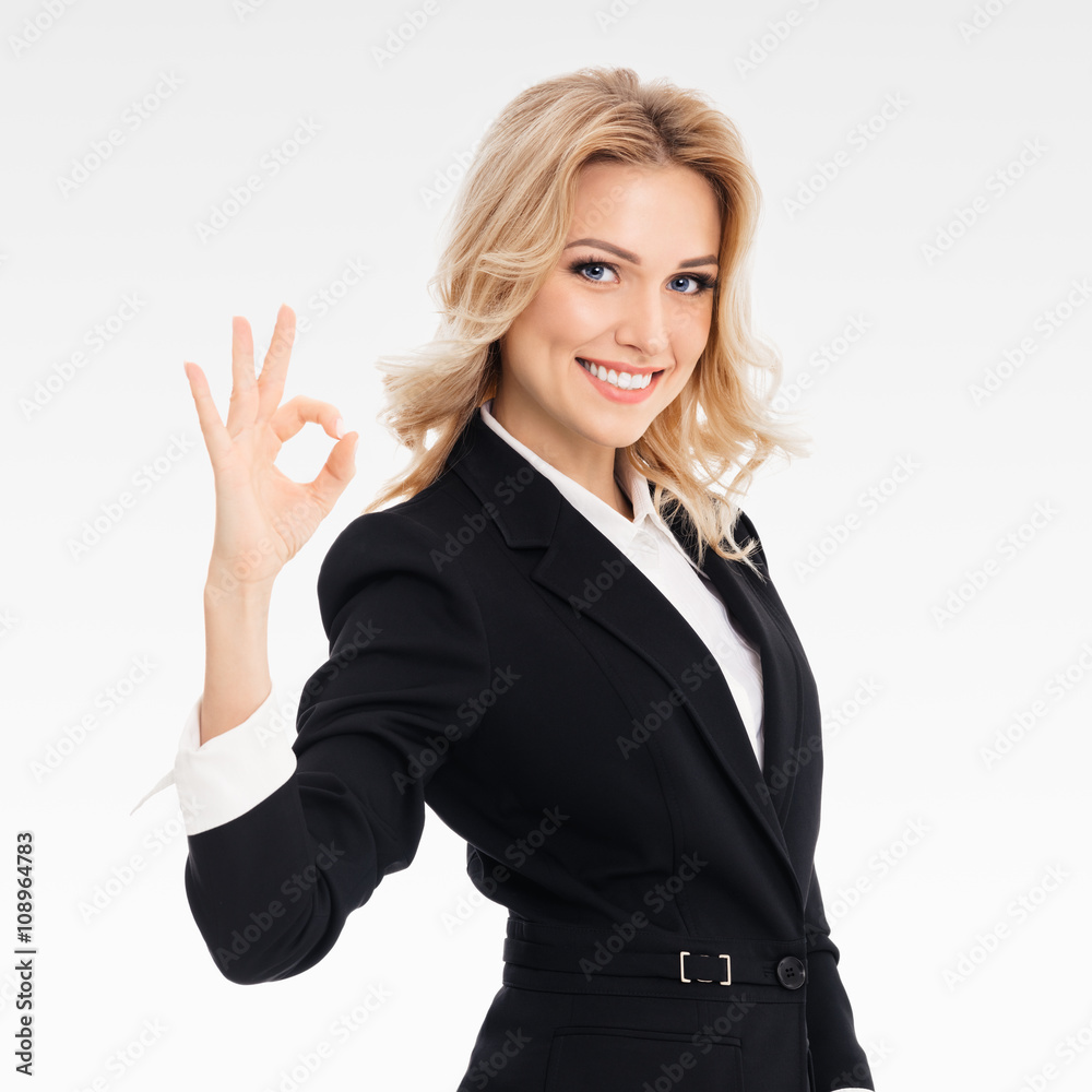 businesswoman showing okay gesture businesswoman showing okay gesture