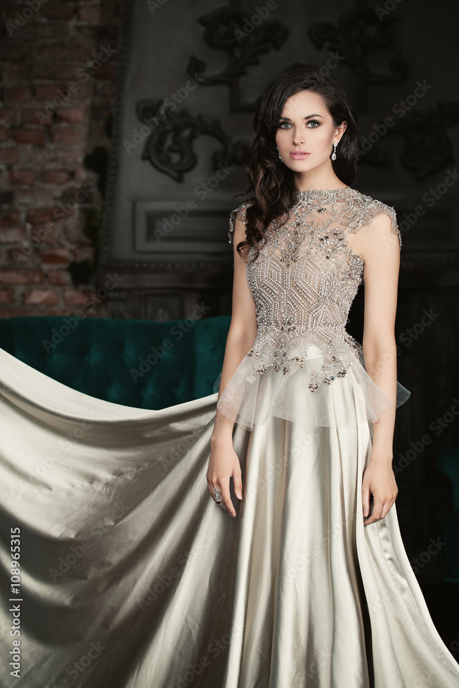 Elegant Woman Wearing a Long Silver Dress