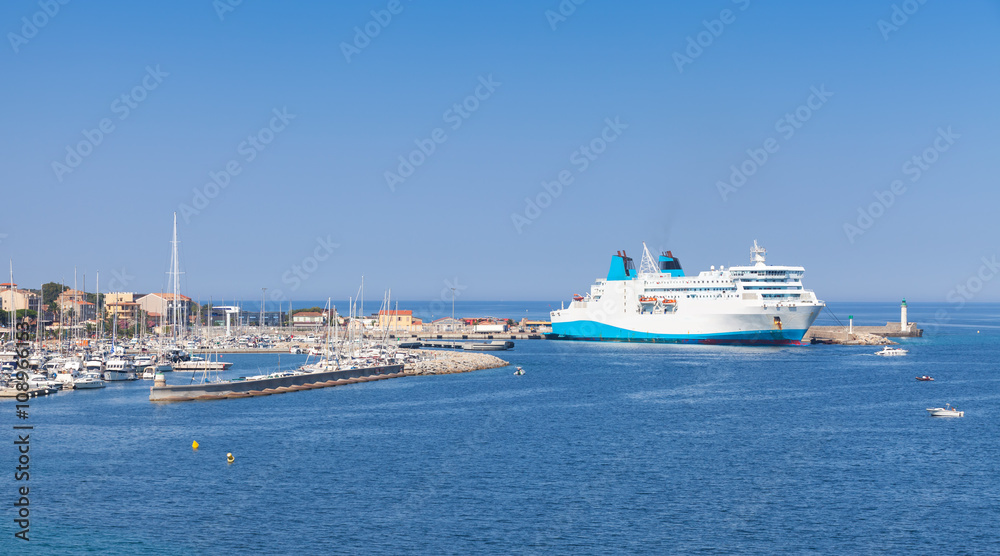 White ferry ship moored in port of Propriano