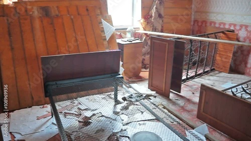 Pan through interior of damaged abandoned house