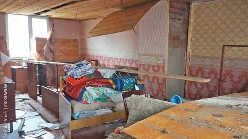 Pan through interior of damaged abandoned house