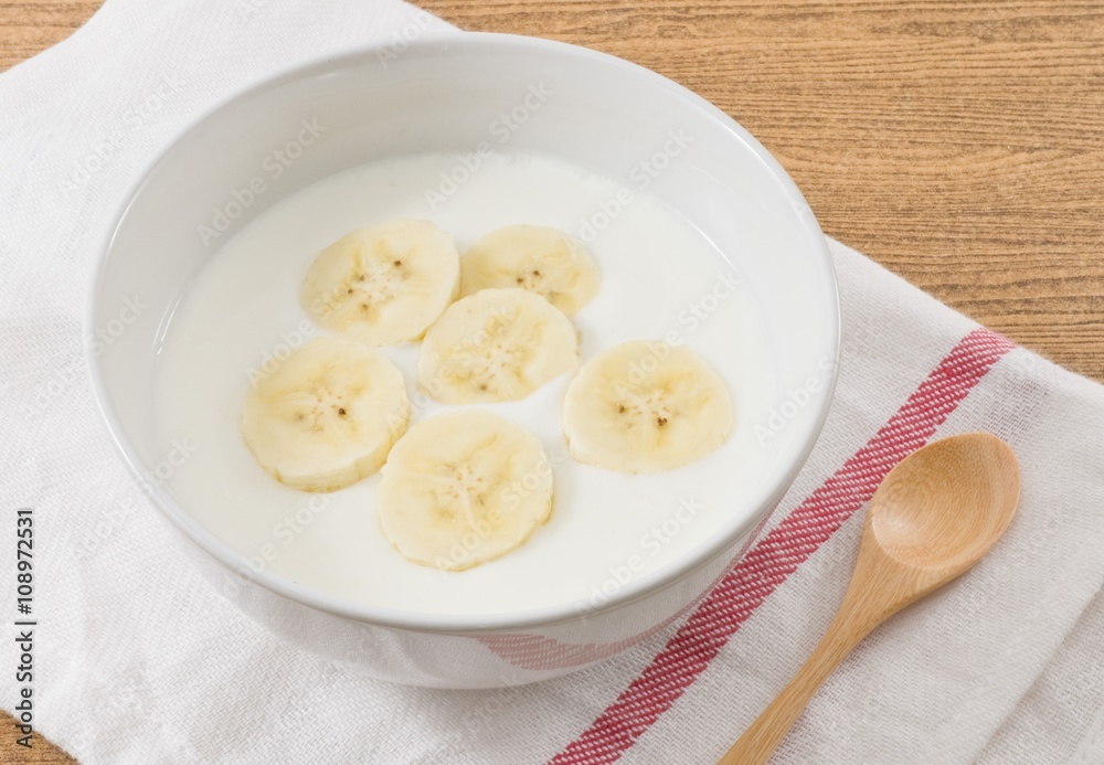 Bowl of Homemade Yoghurt with Ripe Banana Bowl of Homemade Yoghurt with Ripe Banana